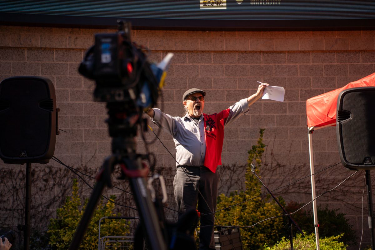 Chicano and latino studies professor Ronald López attempts to rile up the crowd before the state legislative forum at Sonoma State University on Friday, Feb. 21, 2025.