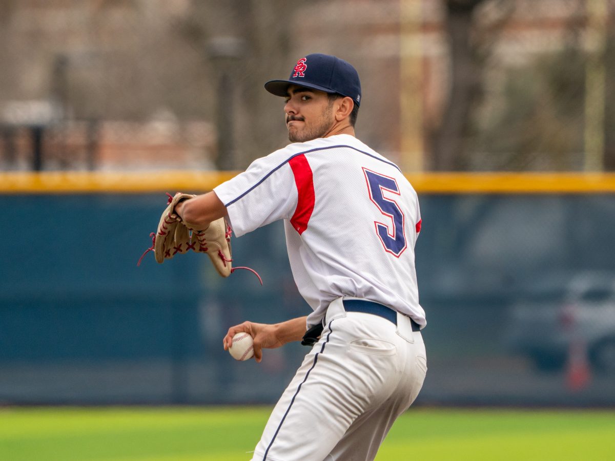 Freshman starter Evan Sandoval winds back for another pitch in the game against Lassen College at home, Sunday, Feb. 16, 2025.