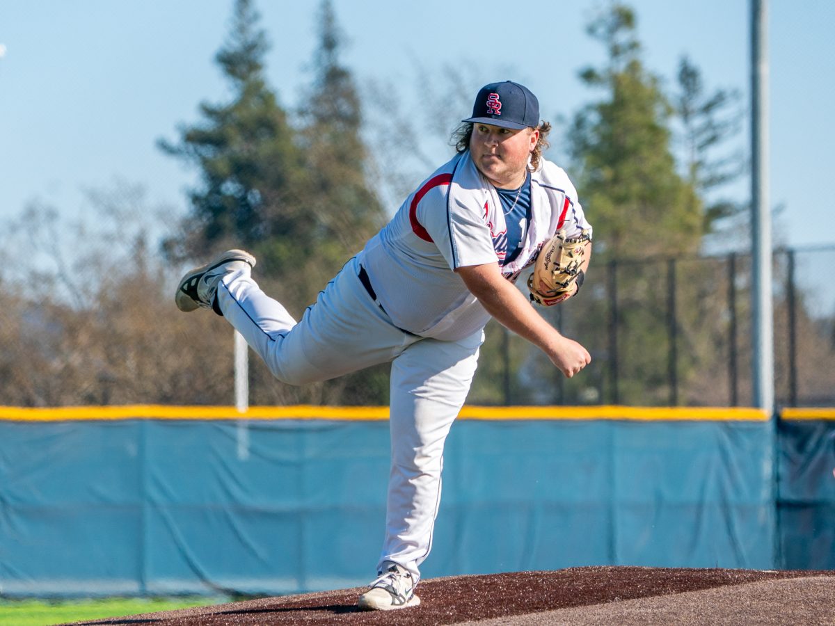 Freshman Luke Dillon looks for the call as he finishes a pitch in the game against West Valley College at home, Jan. 28, 2025.