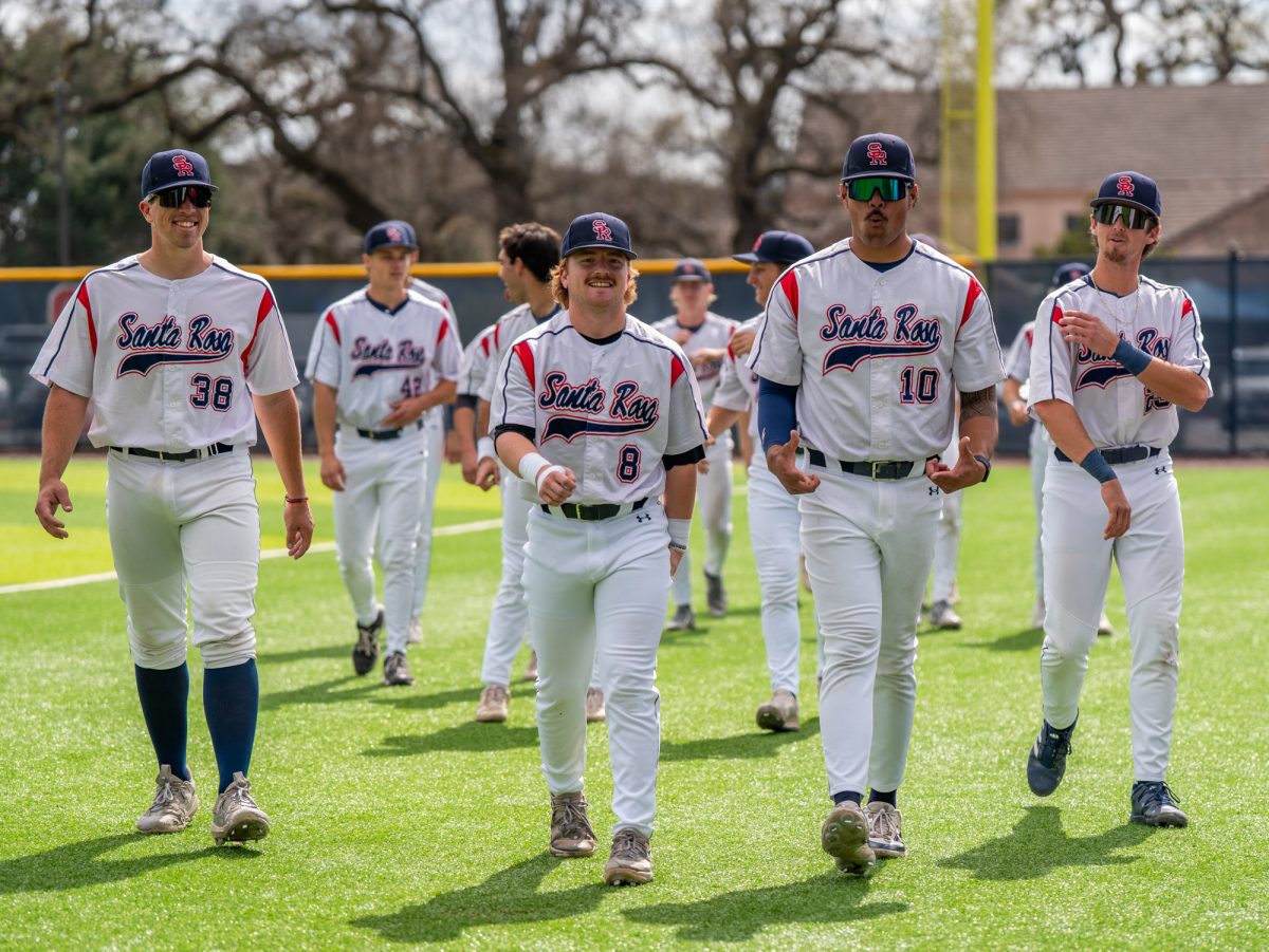 From left to right, Matt Anderson, Joe Brown, Vero Poueu and Caze Derammelaere walk towards the dugout after the pre-game huddle prior to the game against San Joaquin Delta on Tuesday, March 11, 2025 in Santa Rosa.