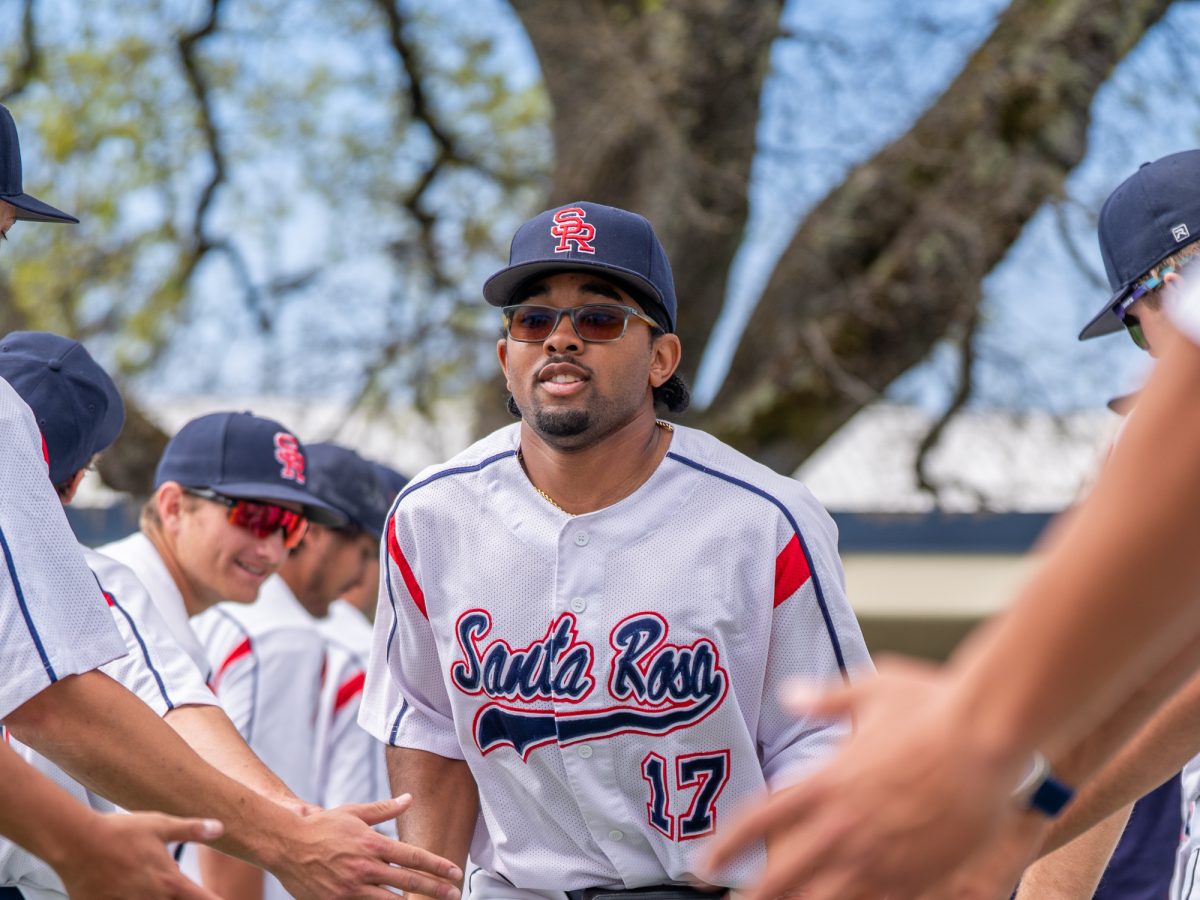 Freshman Anane Wilson runs out to his position in left field prior to the home game against San Joaquin Delta on Tuesday, March 11, 2025 in Santa Rosa.