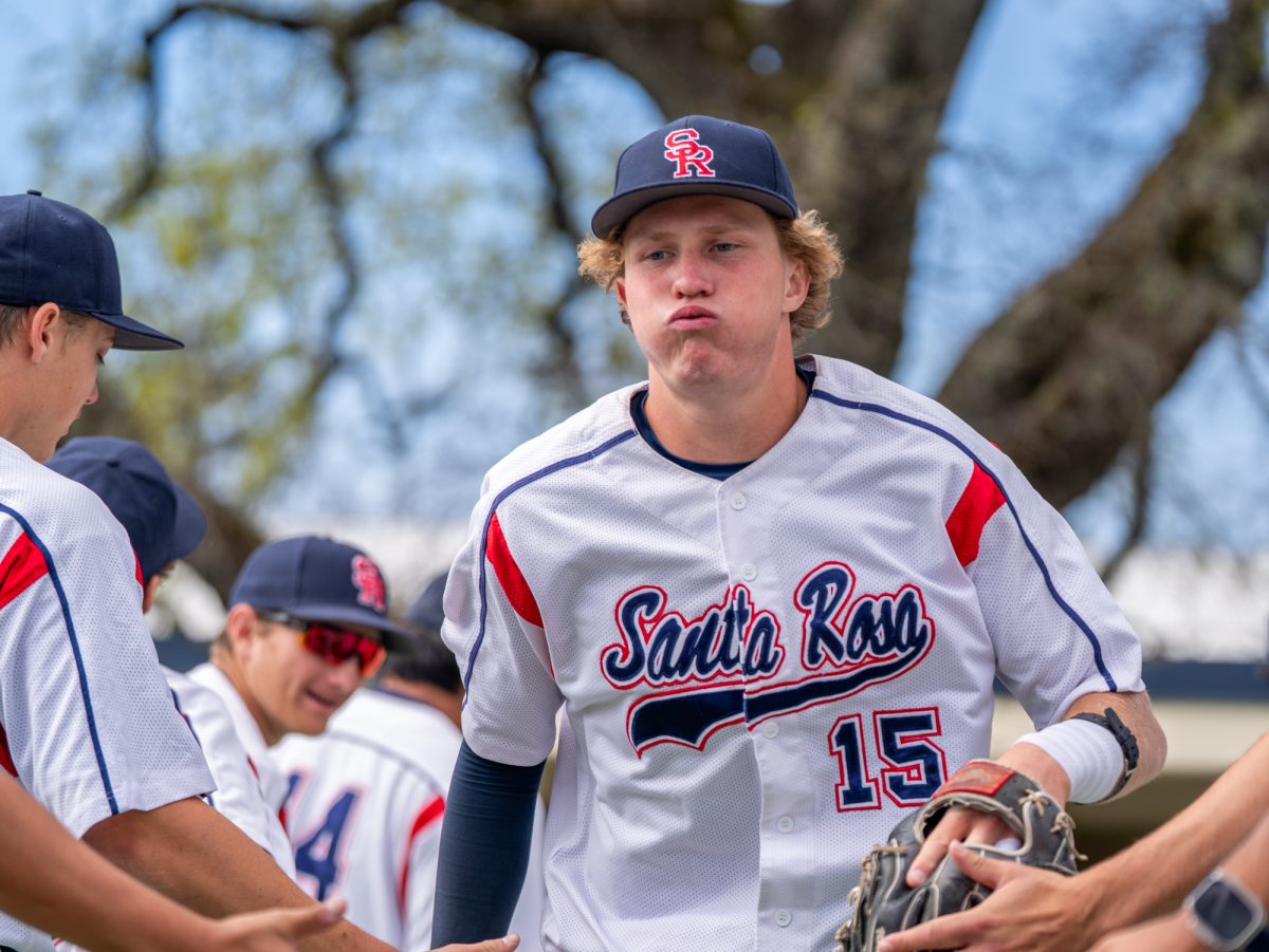 Freshman shortstop Brett Neidlinger steadies himself and runs out to his position prior to the home game against San Joaquin Delta on Tuesday, March 11, 2025 in Santa Rosa.
