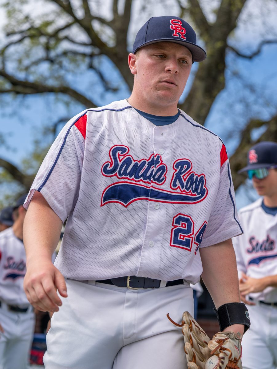 Starting pitcher Russell Freedheim is focused as he walks out of the dugout and towards the mound prior to the game against San Joaquin Delta on Tuesday, March 11, 2025 in Santa Rosa.