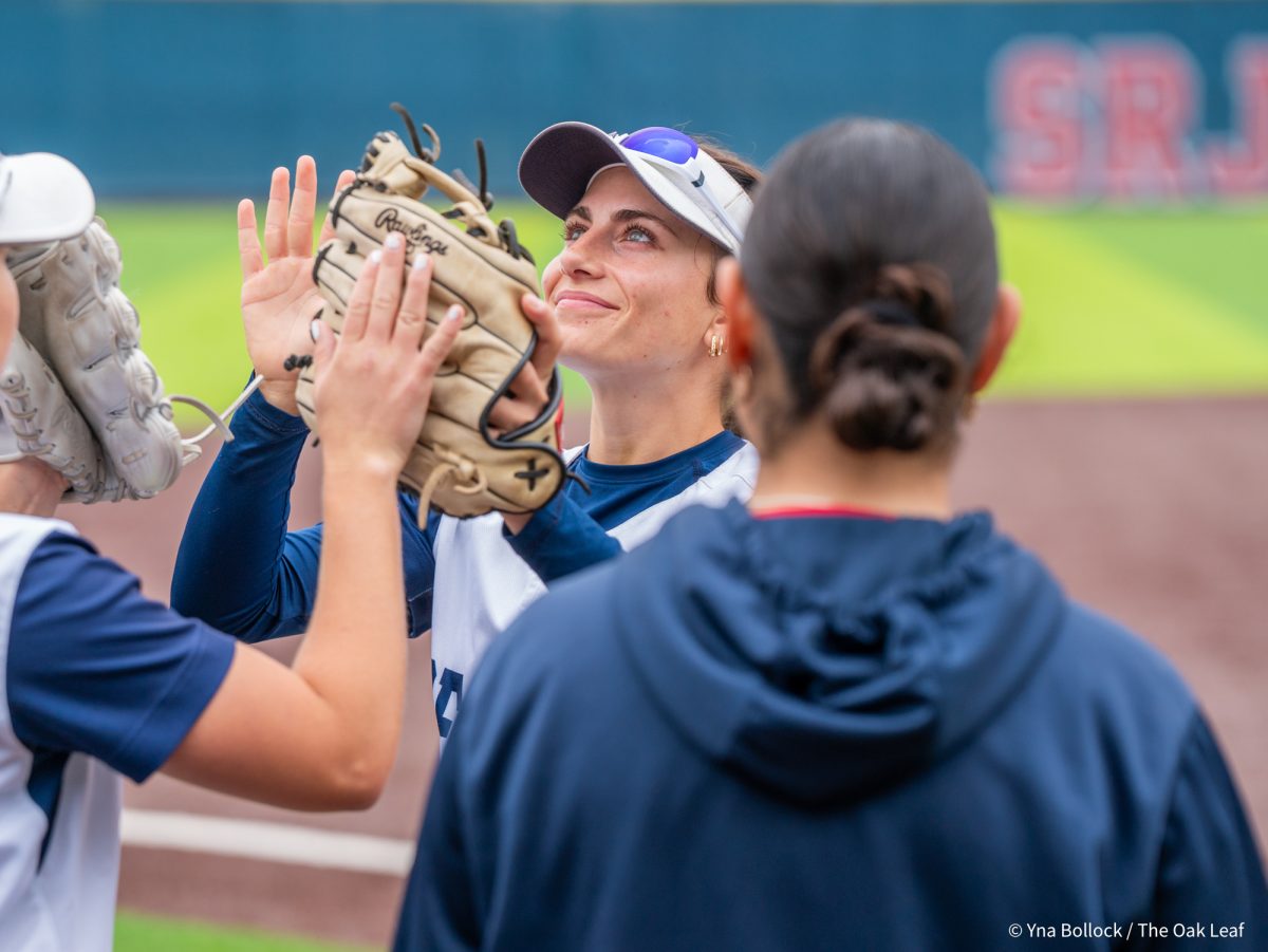 Left fielder Kali Garcia's eyes light up from the sky as she heads down the lineup ahead of the game against Modesto on Saturday, March 15, 2025 in Santa Rosa.