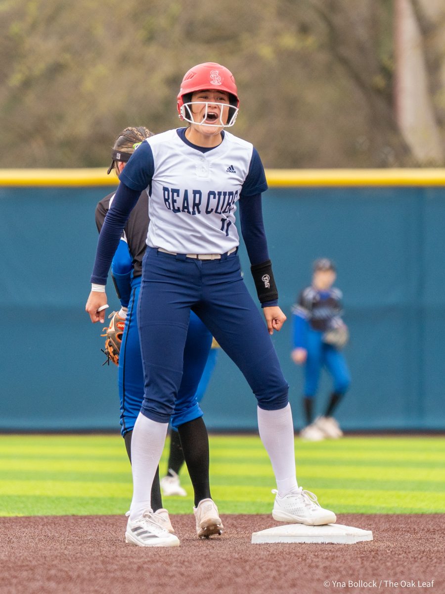 Freshman pitcher Mia Avila reaches second base and celebrates towards the dugout in the game against Modesto on Saturday, March 15, 2025 in Santa Rosa.