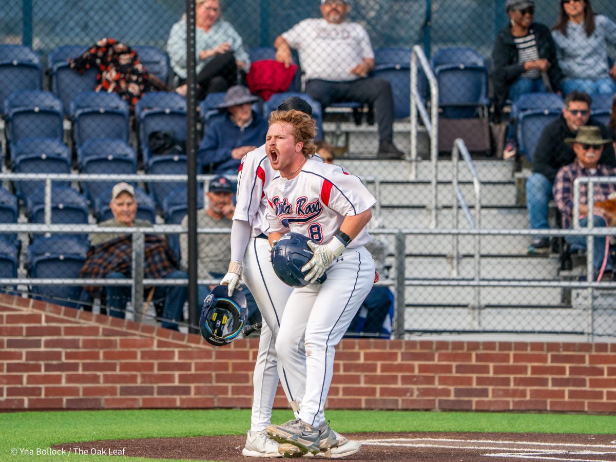 Sophomore second baseman Joe Brown roars at the dugout after making his way back to home plate from a solo home run in the bottom of the eleventh to tie the game against Sierra on Thursday, March 20, 2025 in Santa Rosa.