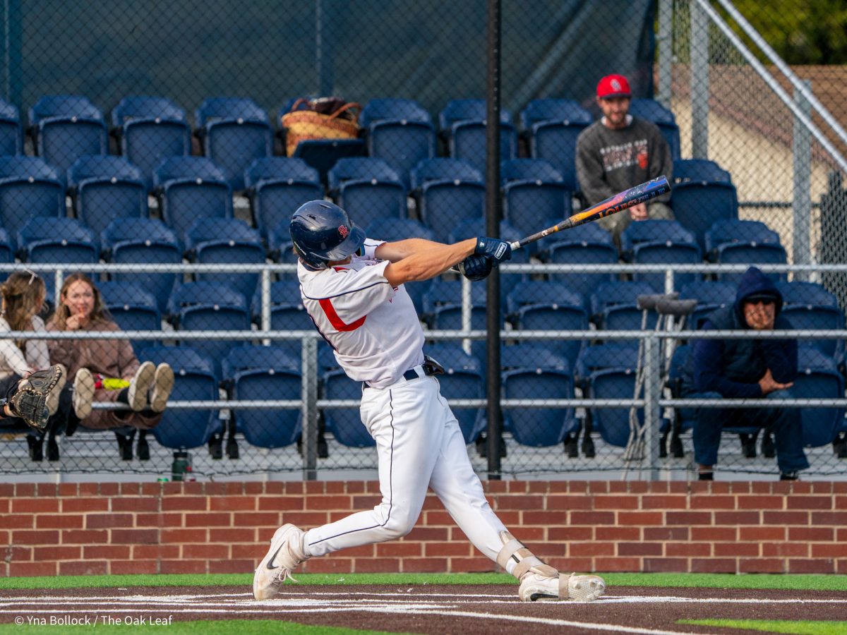 Sophomore catcher Mason Cox pops a ball up to right field and reaches first on an error by Wolverine second baseman Brady Ranallo on Thursday, March 20, 2025 in Santa Rosa.