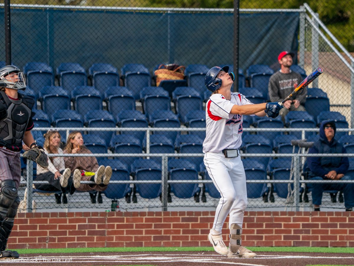 Sophomore catcher Mason Cox pops a ball up to right field and reaches first on an error by Wolverine second baseman Brady Ranallo on Thursday, March 20, 2025 in Santa Rosa.