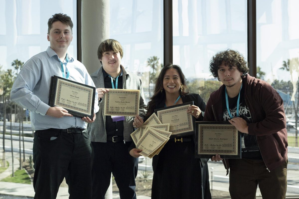 A part of The Oak Leaf's sports department, Oliver Kindt, left, Nathan Kaito Morris, left center, Yna Bollock, right center, and Adair Alvarez Rodriguez right, is all smiles as they show off their awards at the ACP Spring National Media Conference on Saturday, March 8, 2025 in Long Beach, California.
