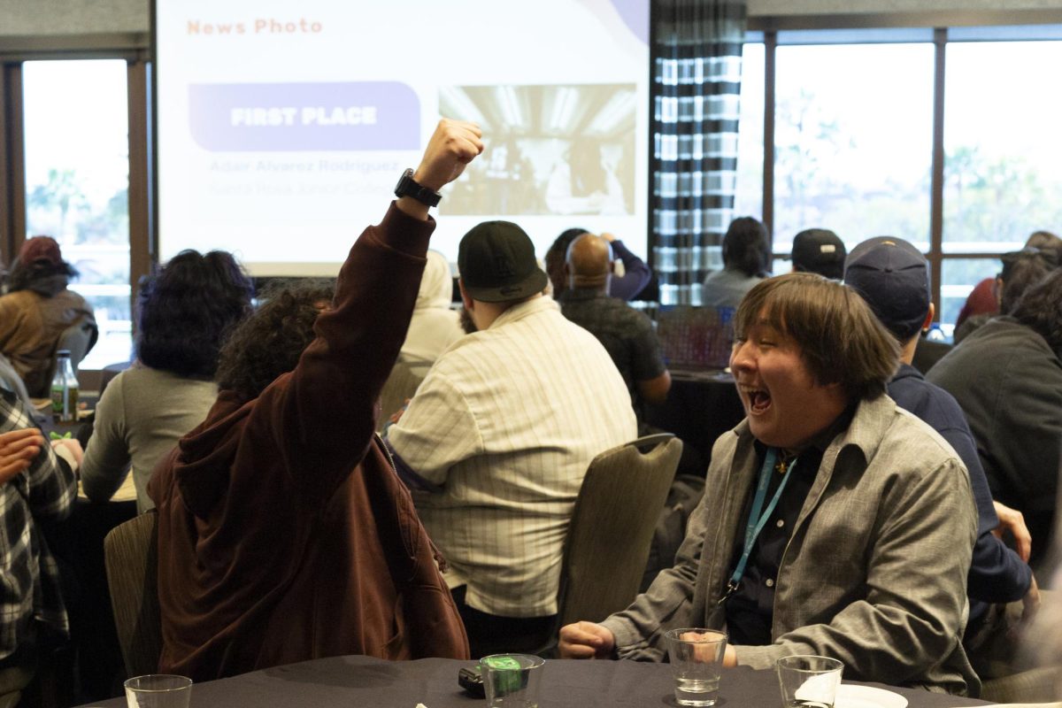 The Oak Leaf's photographers, Adair Alvarez Rodriguez and Nathan Kaito Morris celebrates loudly as Rodriguez places first for "On the Spot News Photo" at the ACP Spring National Media Conference on Saturday, March 8, 2025 in Long Beach, California.