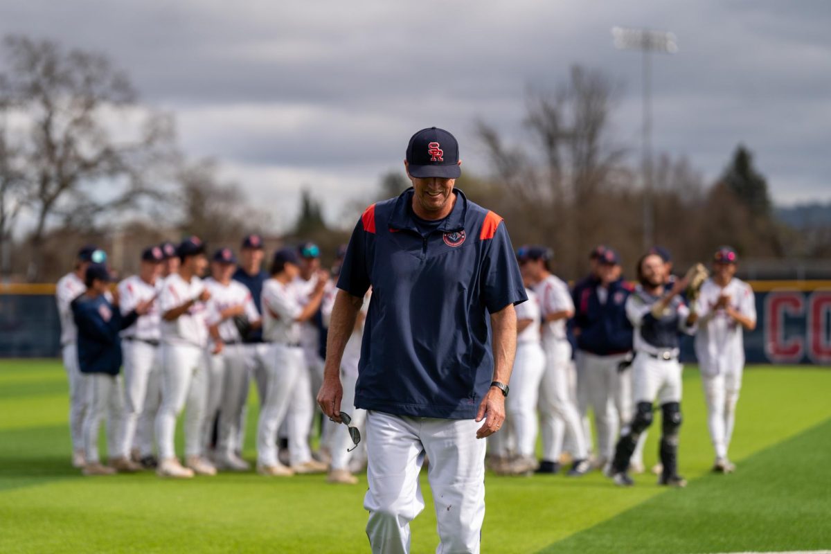 Santa Rosa Junior College Head Coach Damon Neidlinger cracks a smile after his team sings "Happy Birthday" to him after their win against San Joaquin Delta on Tuesday, March 11, 2025 in Santa Rosa.