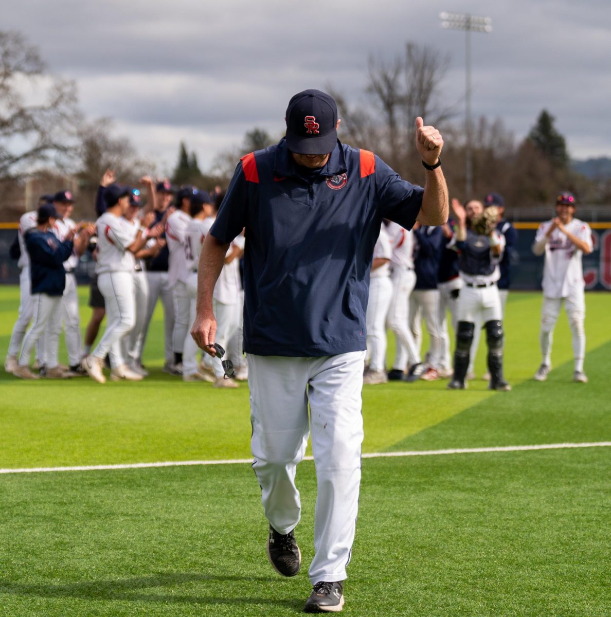 Santa Rosa Junior College Head Coach Damon Neidlinger gives his team a thumbs up after they sing "Happy Birthday" to him after their win against San Joaquin Delta on Tuesday, March 11, 2025 in Santa Rosa.