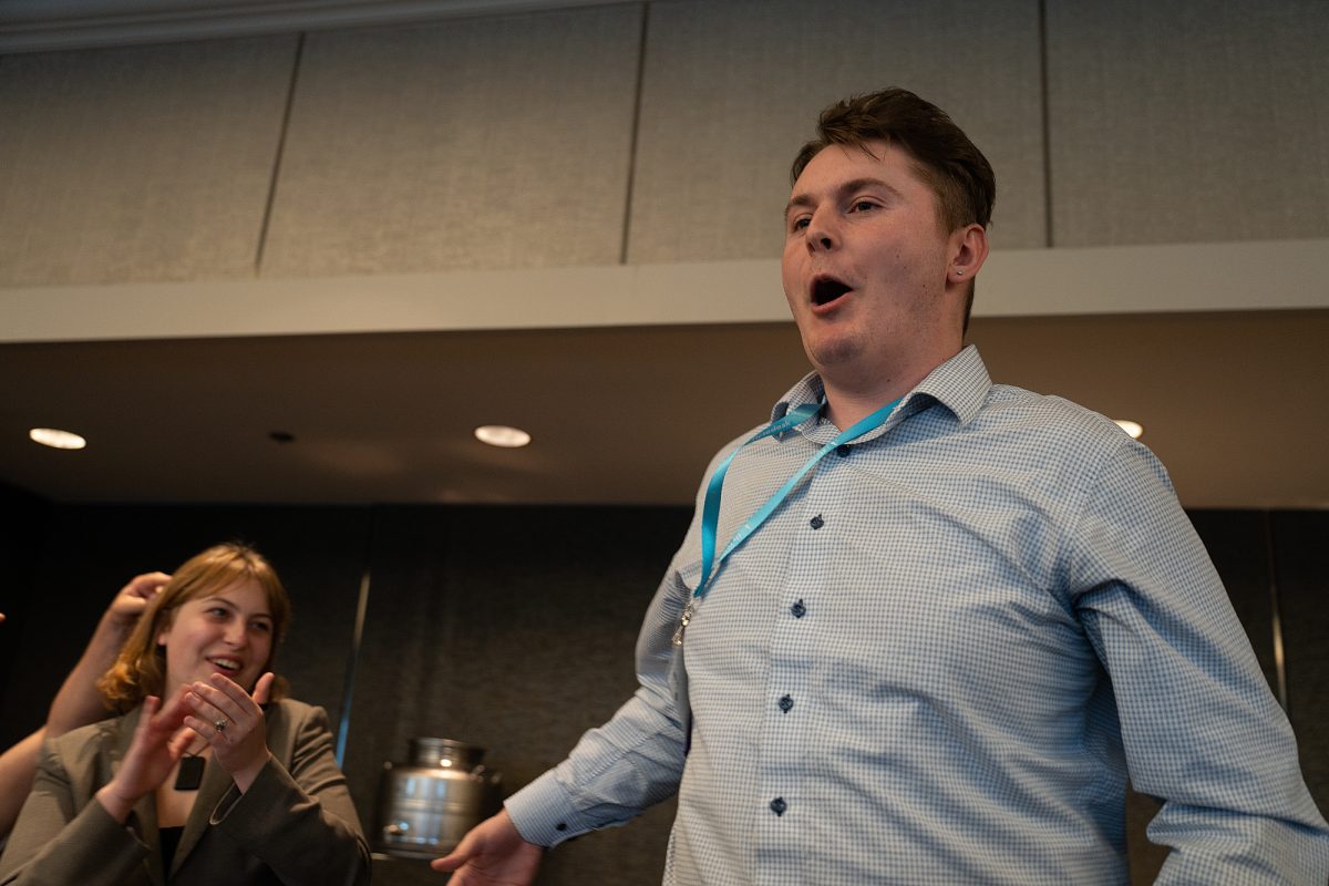 The Oak Leaf's sports editor, Oliver Kindt leaps up in relief and celebration as he takes home the gold for his "On the Spot Sports Writing" entry at the ACP Spring National Media Conference on Saturday, March 8, 2025 in Long Beach, California.