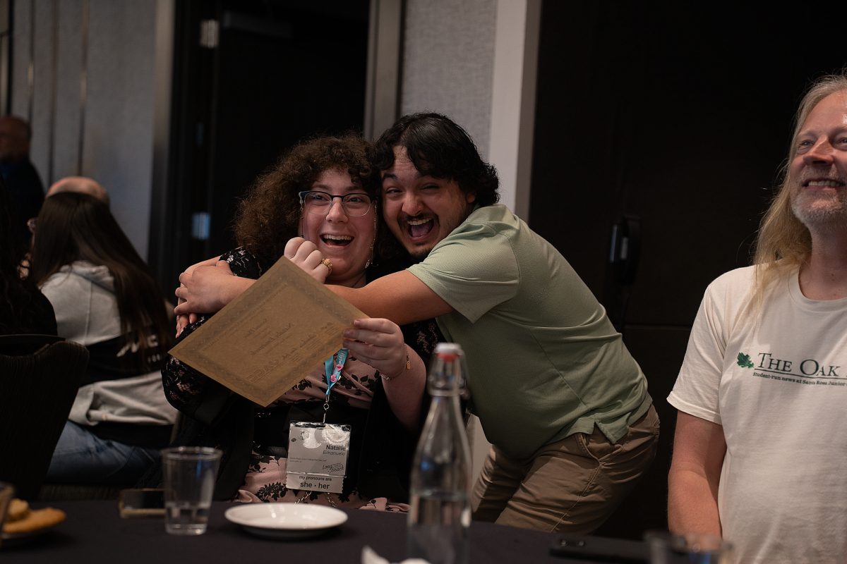 The Oak Leaf's Co-Editor in Chief, Lucas Cadigan-Carranza embraces reporter, Natalie Emanuele, as she places second place in critical review at the ACP Spring National Media Conference on Saturday, March 8, 2025 in Long Beach, California.
