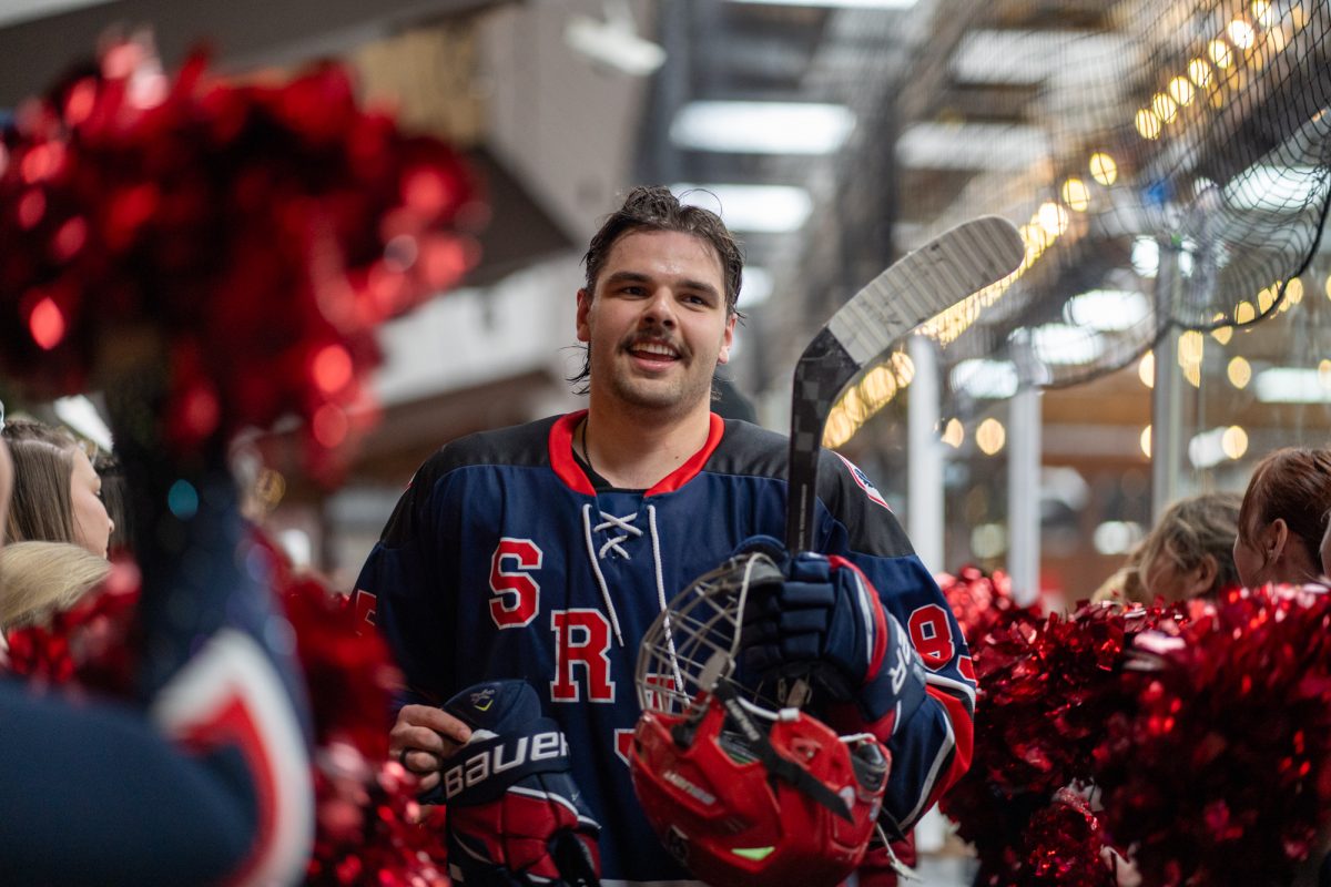 Polar Bears defense Owen Hamblin is met with cheers after a win against the University of Nevada, Reno at Snoopy's Home Ice on Saturday, Feb. 22, 2025.