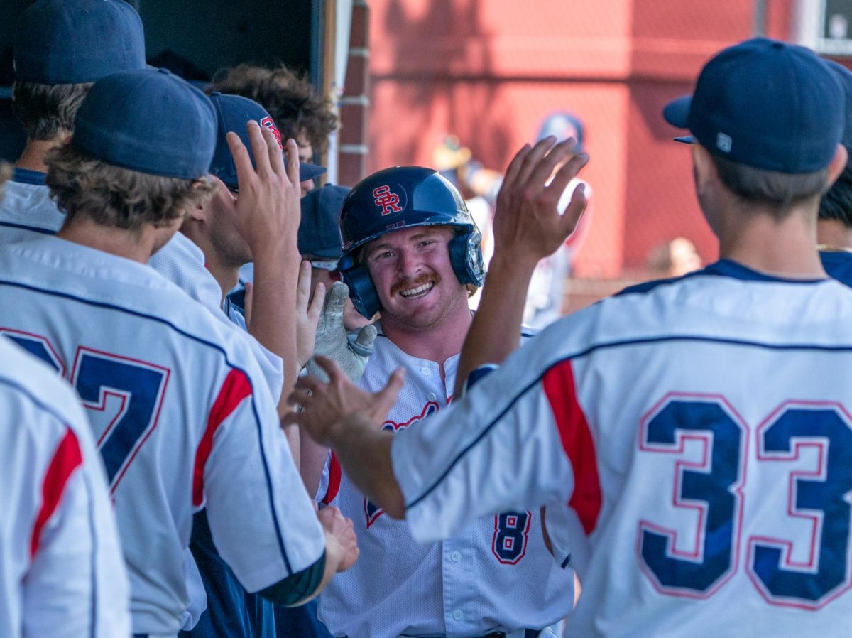 Sophomore third baseman Joe Brown walks through the dugout after scoring on Moran's single to left field, making the score 3-0 in the bottom of the third against Diablo Valley College on Thursday, April 3, 2025 in Santa Rosa.