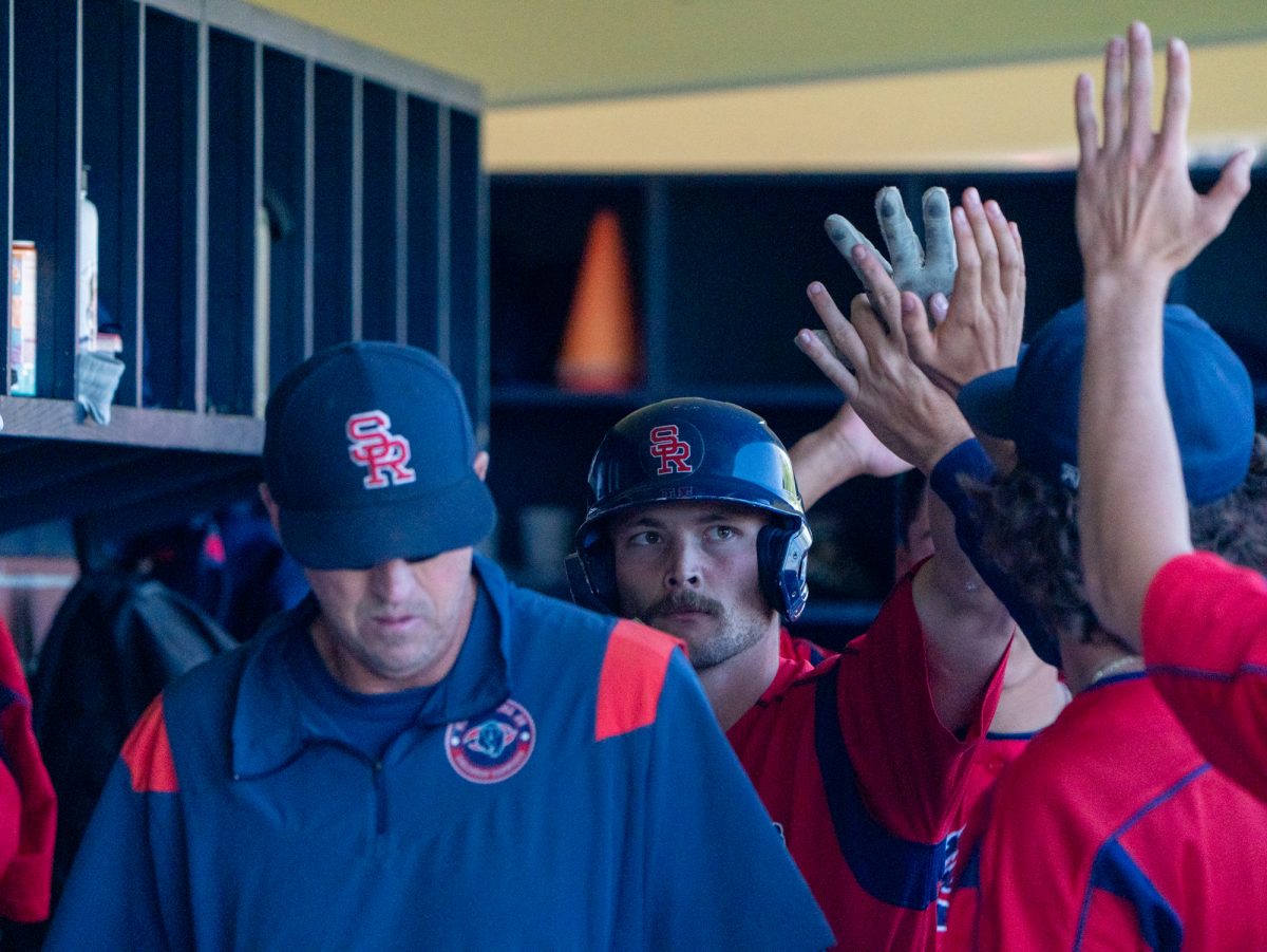 Freshman left fielder Shane Moran goes up for five after a walk sends him home in the bottom of the sixth against Sacramento City College on Friday, April 18, 2025 at home.