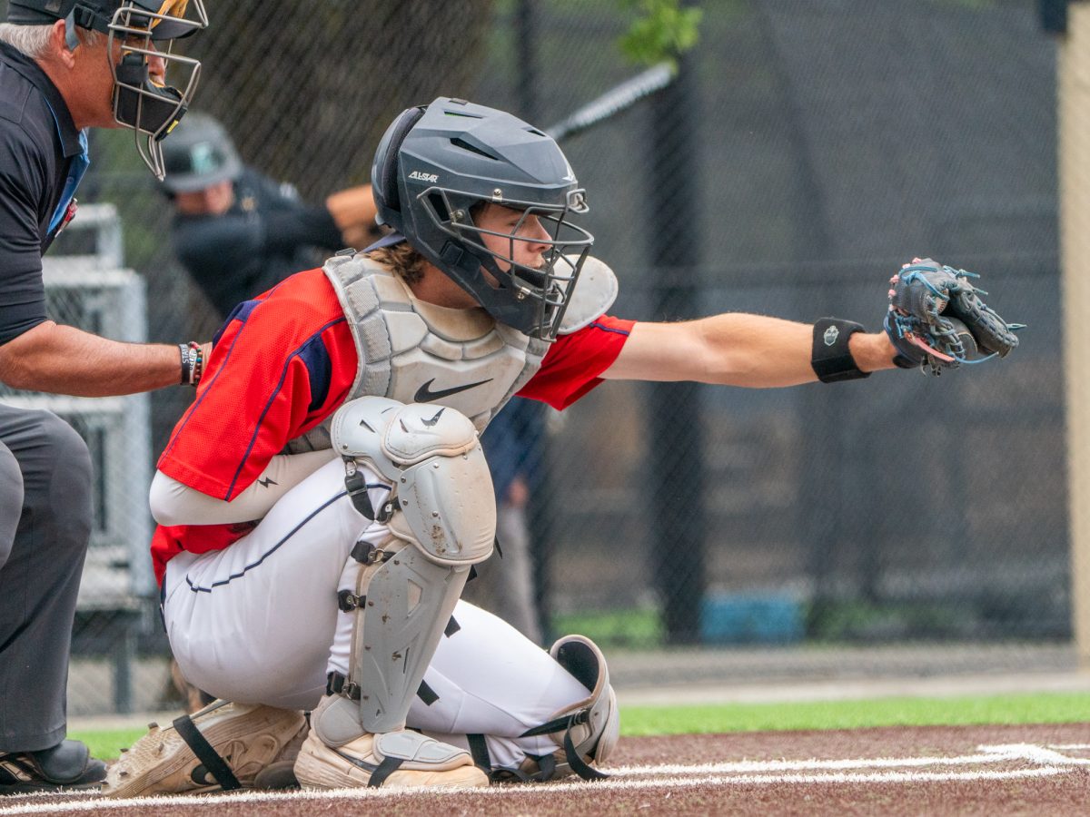 Sophomore catcher Mason Cox receives a pitch from his brother Brice in the game against Folsom Lake on Thursday, April 24, 2025 at home.