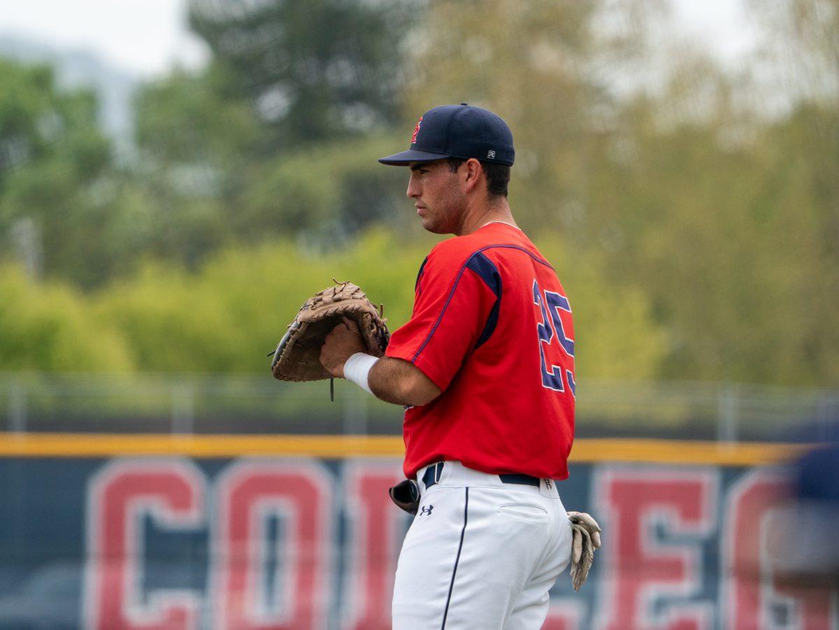 Sophomore first baseman Josh Martin stands ready to receive the ball at first base during the game against Folsom Lake on Thursday, April 24, 2025 at home.