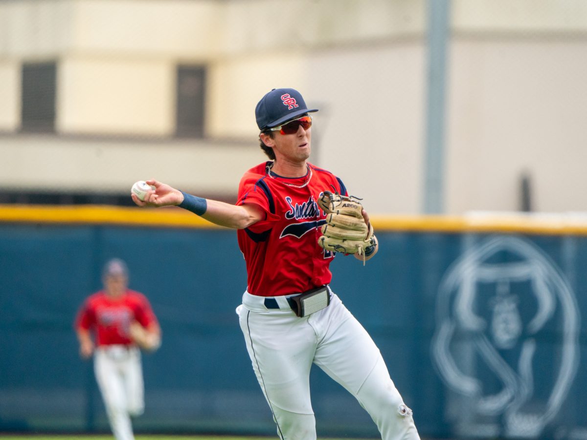 Freshman short stop Caze Derammelaere throws a grounder from short stop to first in the top of the third against Folsom Lake on Thursday, April 24, 2025 at home.