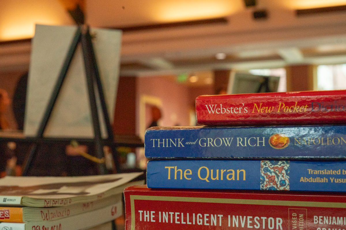 Santa Rosa Junior College's Second Chance Club displays pieces of religious writing, as well as business and self help books in Bertolini Hall on Tuesday, April 15, 2025 in Santa Rosa. Palacio, who made the piece turned to these books during his time incarcerated. 