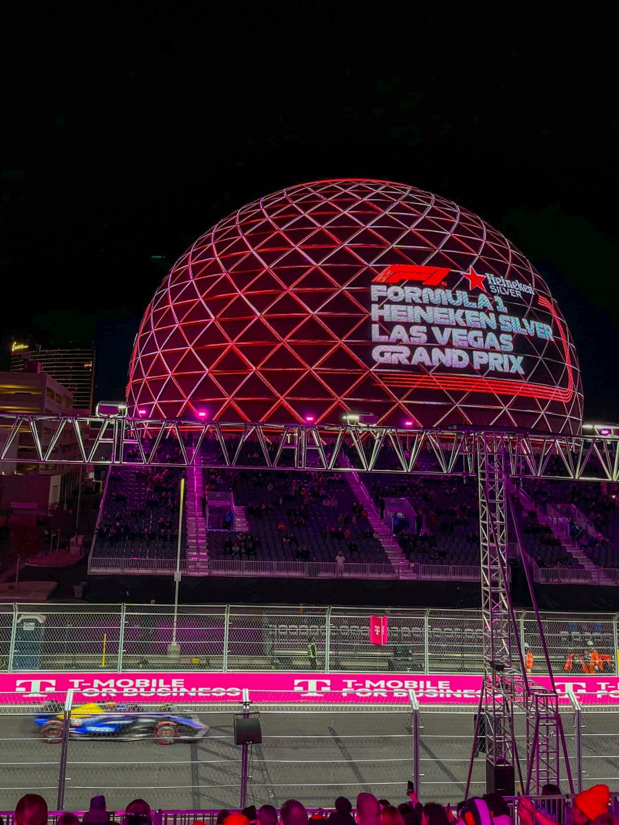 Cars speed down the track as the Las Vegas sphere illuminates the night at the Las Vegas Grand Prix Qualifying on the Las Vegas strip in Nevada on Nov. 28. 