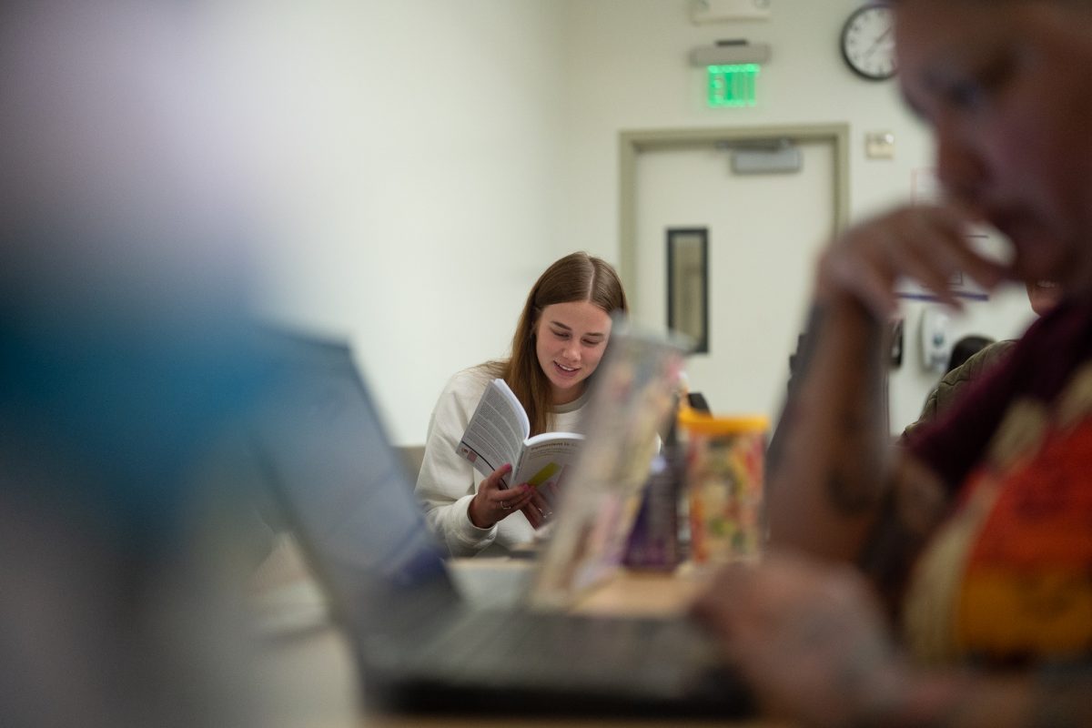 Ava O'Brien reads a section in Feminism is Queer by Mimi Marinucci during a Women and Gender Studies class in 35 Darwin at Sonoma State University on April 2, 2025. Feminism is Queer is a book that discusses both feminist theory and queer theory, and finds the relation between both schools of thought.