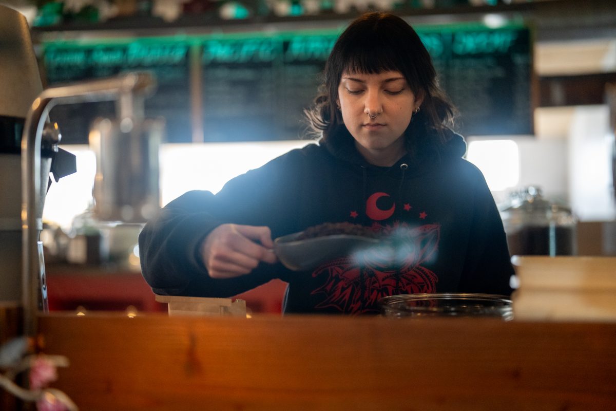 Petaluma Tea & Coffee barist Hazel filters through coffee to beans before putting a bag of them up for sale at Petaluma Tea & Coffee on 212 2nd St. in Petaluma on March 31, 2025.