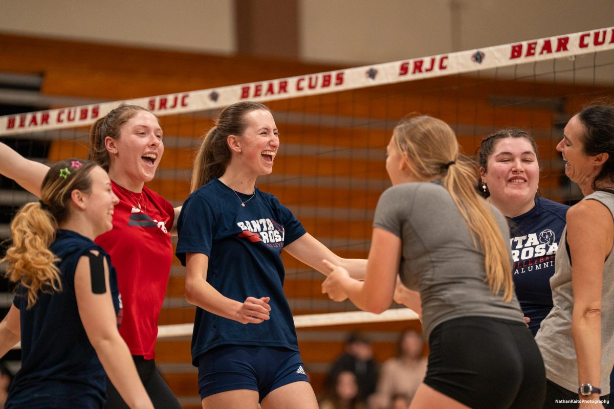 Santa Rosa Junior College's current volleyball team celebrates loudly as freshman Haylen Guynup gets on the scoresheet against the most recent alumni team on Friday, April 18, 2025 at Haehl Pavilion.