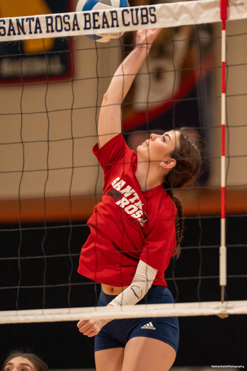 Santa Rosa Junior College's freshman Jillian Mefferd surges up for a spike against  a team of alumni on Friday, April 18, 2025 at Haehl Pavilion. 