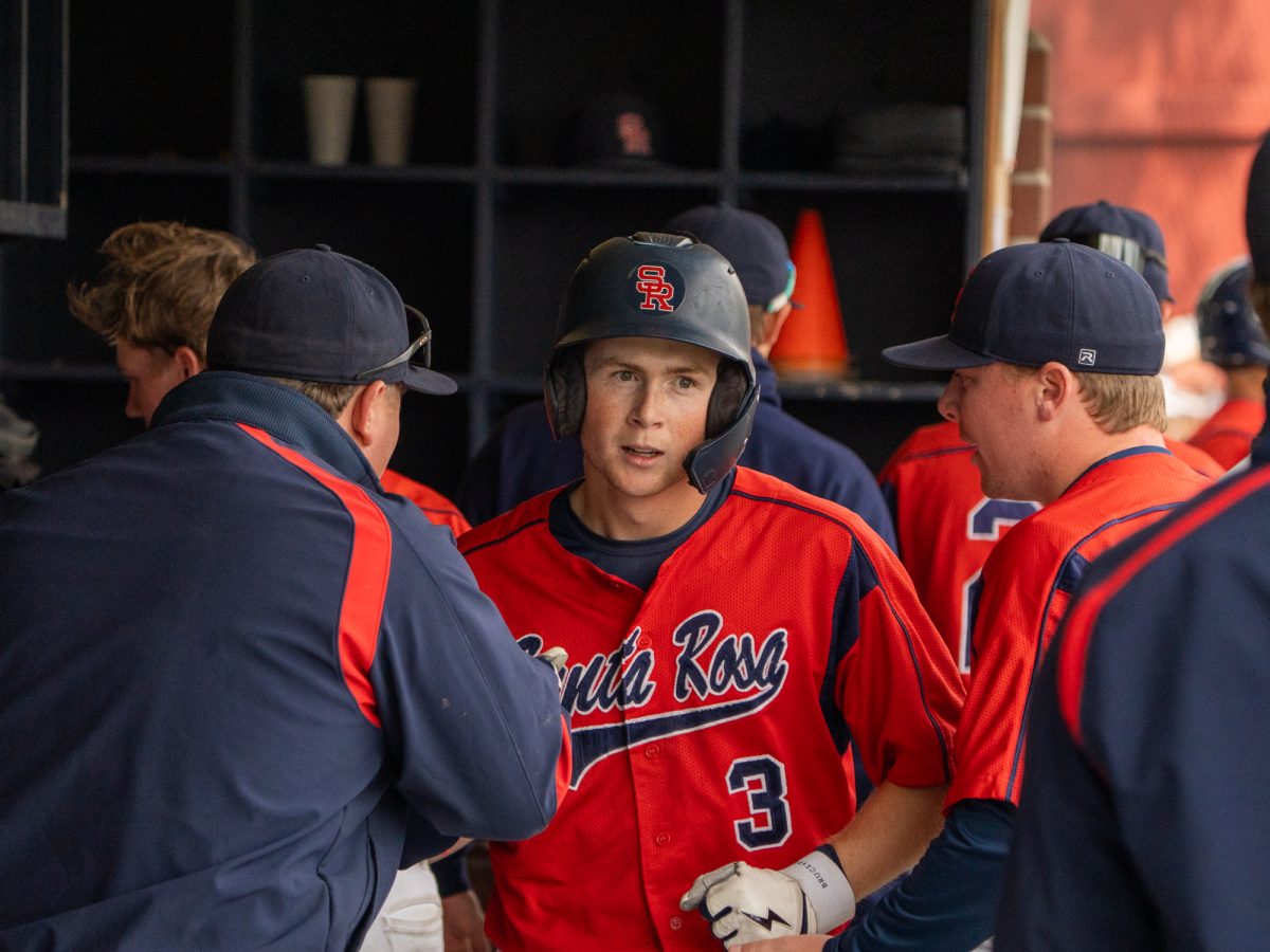 Sophomore third baseman Tyler Nordyke walks through the dugout after scoring in the bottom of the sixth against American River on Saturday March 29, 2025 in Santa Rosa.