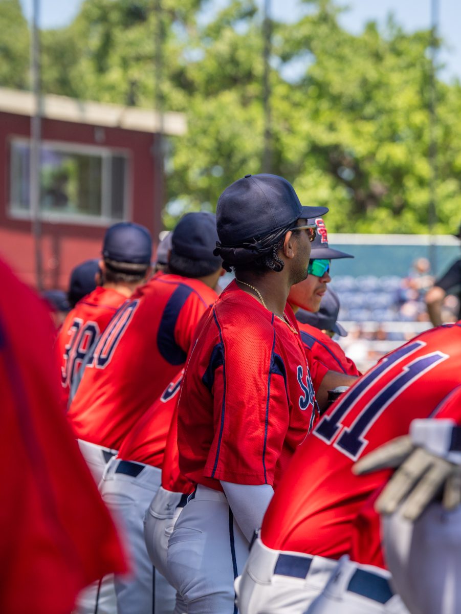 The SRJC baseball team stand in the dugout as rosters are read overhead during the first game of the 3C2A Baseball Regionals against American River College on Friday, May 2, 2025 at home. 