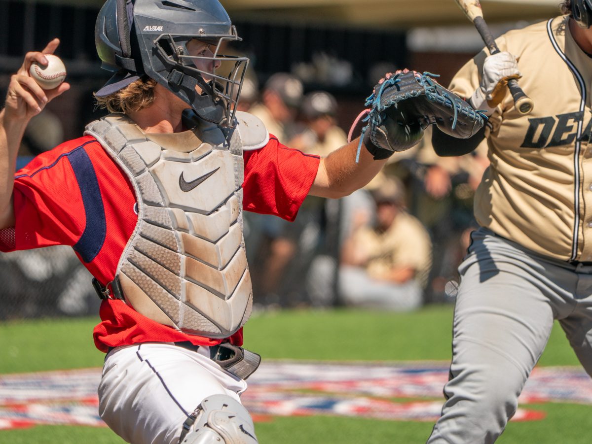 Sophomore Mason Cox winds back to throw the ball back to the pitcher during the game against Delta College on the first day of the 3C2A Super Regional playoffs on Thursday, May 8, 2025 at home. 