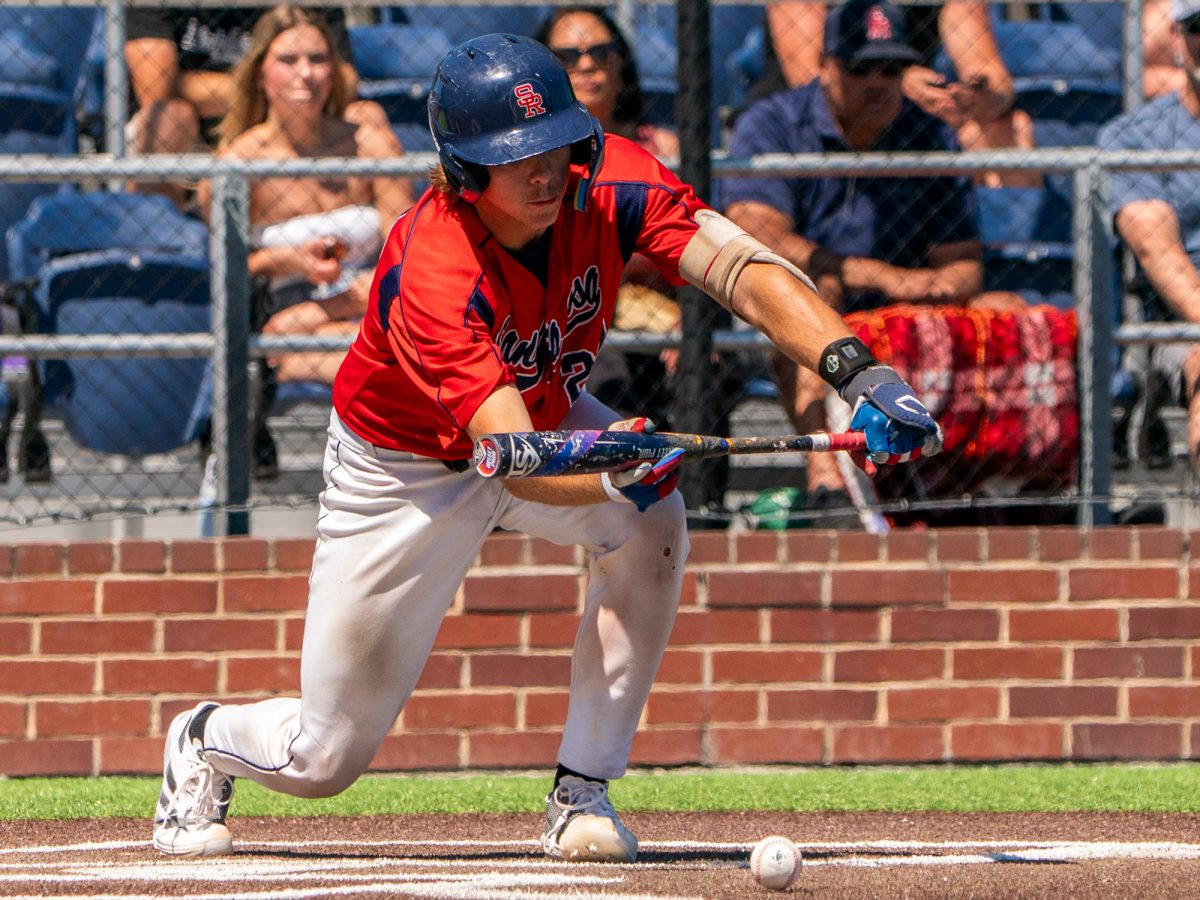 Sophomore Mason Cox bunts and grounds out to the catcher and advances freshman Caze Derammelaere to second base in the bottom of the seventh of the first game against Folsom Lake on the second day of the 3C2A Super Regional playoffs on Friday, May 9, 2025 at home. 