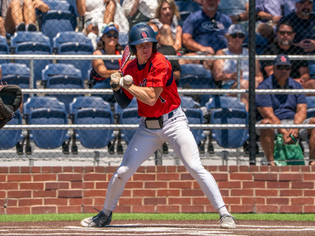 Freshman Ayden Herrguth is hit by a pitch from Folsom Lake's Jarren Ekelboom in the bottom of the first in the first game against Folsom Lake on the second day of the 3C2A Super Regional playoffs on Friday, May 9, 2025 at home. 