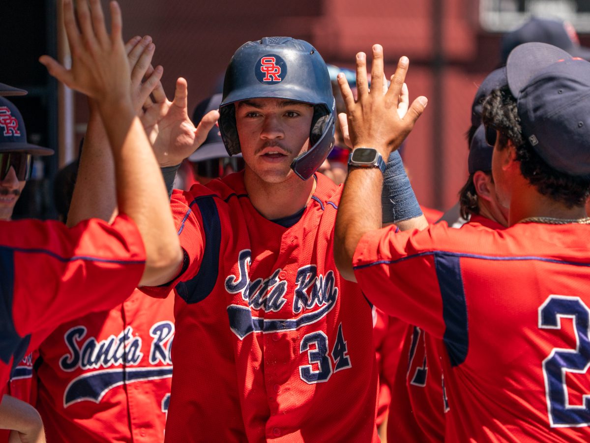 Freshman J.T. Summers walks down a tunnel of high-fives after hitting a 3-run homer in the top of the fourth against Folsom Lake on the final day of the 3C2A Super Regional playoffs on Saturday, May 10, 2025 at home. 