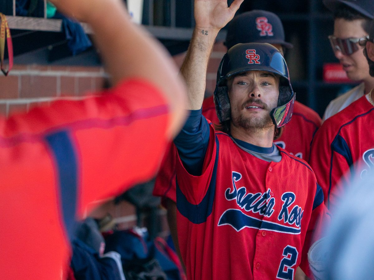 Sophomore catcher Cameron Duran is greeted with a high five in the dugout after sophomore Josh Martin's walk sends him home in the top of the seventh against Folsom Lake on the final day of the 3C2A Super Regional playoffs on Saturday, May 10, 2025 at home. 