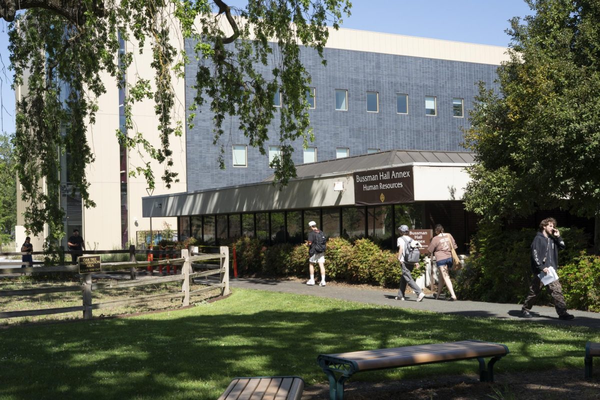 Students walk in front of Bussman Hall Annex, which is home to SRJC's Information Technology Department, on May 5. 