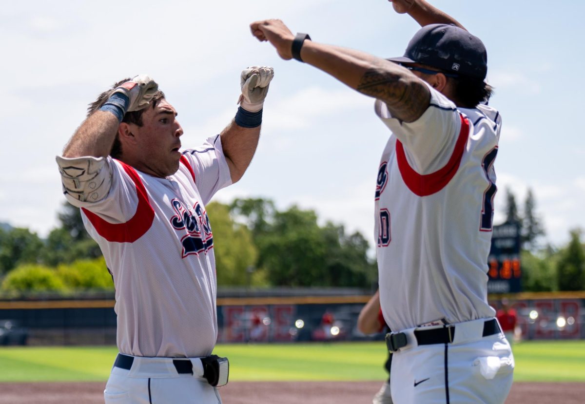 Bear Cubs first baseman Josh Marin, left, leaps into the air with teammate Vero Poueu after hitting a grand slam in the top of the 7th against American River College in game 2 of the 3C2A regional playoffs on Saturday, May 3, 2025 in Santa Rosa.
