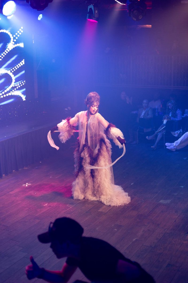 April Carrion basks in the spotlight while commanding the crowds gaze during a performance at Hamburger Mary's in Long Beach, California on March 7, 2025.