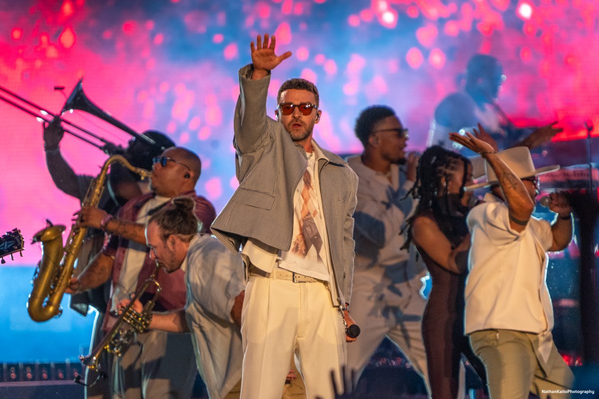 Justin Timberlake gestures towards the crowd, surrounded by musicians and dancers as he performs, "No Angels," on the JaM Cellars Stage at BottleRock Napa Valley on Saturday, May 24, 2025 in Napa.
