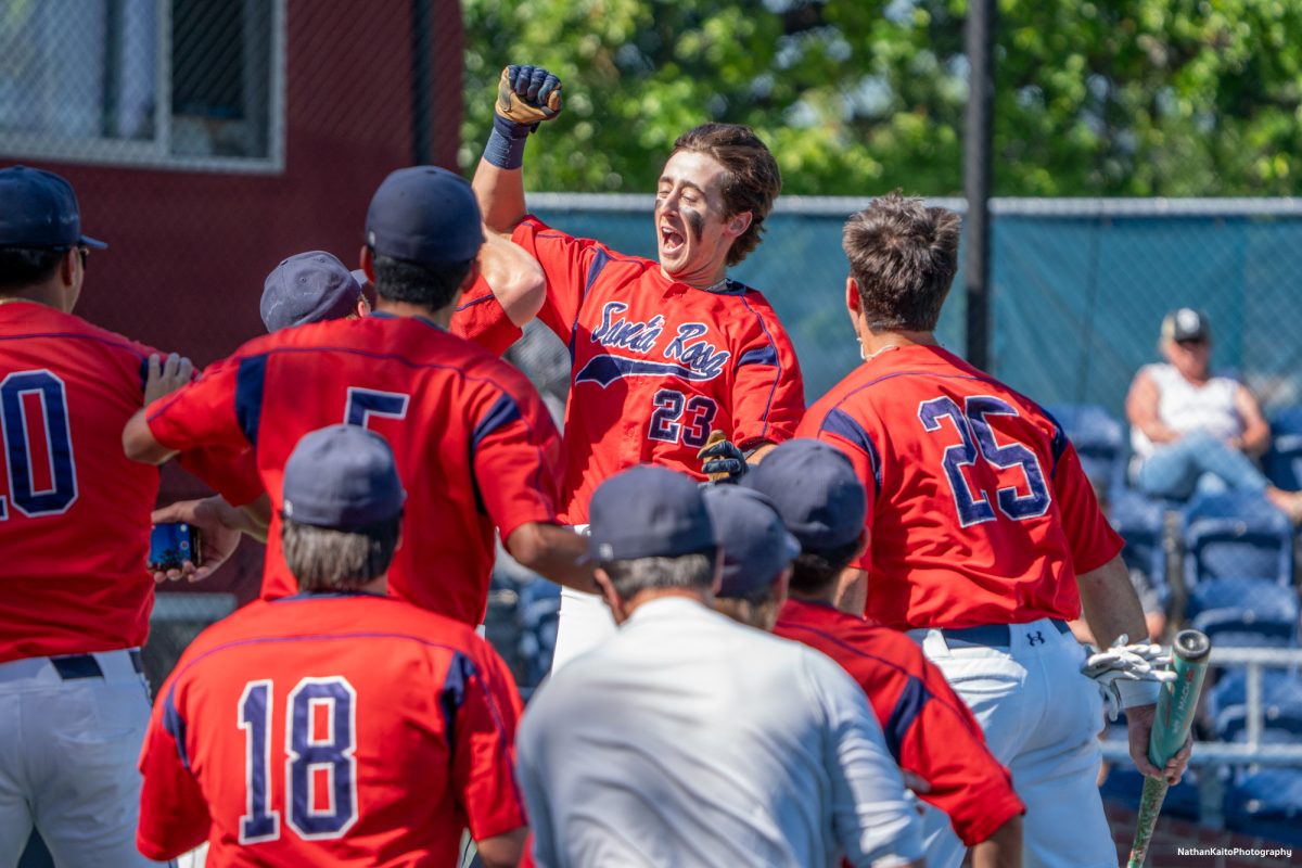 Freshman Caze Derammelaere meets the team at the opening of the dugout after hitting a home run to left field in the bottom of the second against Delta College on the first day of the 3C2A super regional playoffs on Thursday, May 8, 2025 at home. 