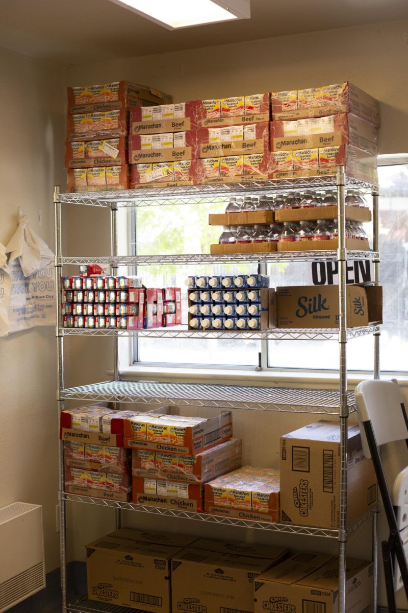A stocked shelf of dry goods and shelf-stable milk and milk alternatives sits inside the Bailey Food Kiosk at Santa Rosa Junior College on May 8, 2025.