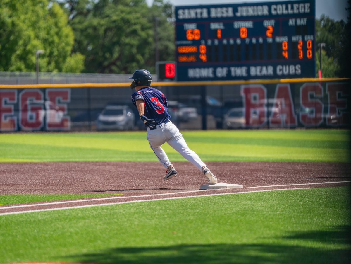 Sophomore third baseman Tyler Nordyke rounds first and bolts for second after hitting into left field to send freshman Shane Moran home in the bottom of the first against Sierra in game one of the 3C2A Regional Finals on Friday, May 16, 2025 in Santa Rosa.