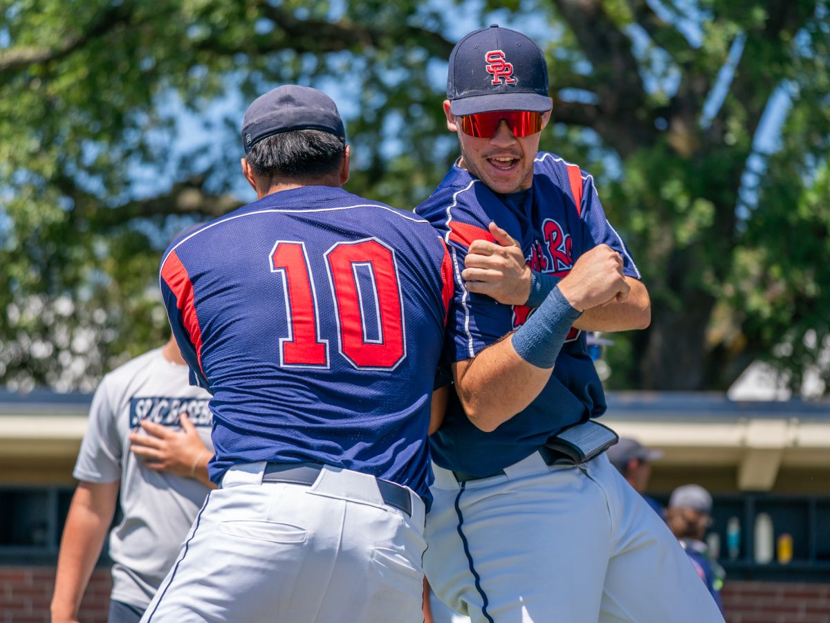 From right to left, freshmen JT Summers and Vero Poueu get hyped at lineup before playing against Sierra in game three of the 3C2A Regional Finals on Sunday, May 18, 2025 in Santa Rosa.
