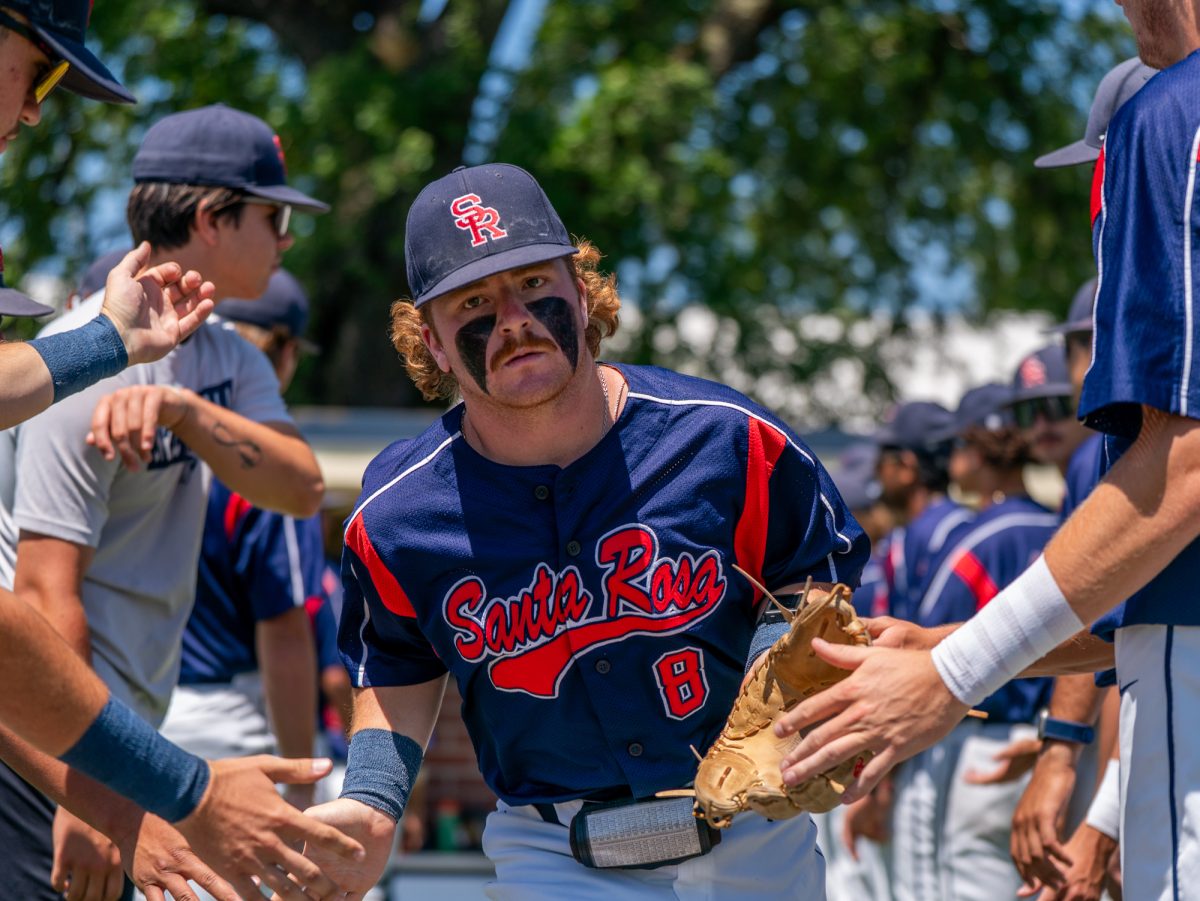 Sophomore third baseman Joe Brown runs out of the dugout for lineup one final time before playing against Sierra in game three of the 3C2A Regional Finals on Sunday, May 18, 2025 in Santa Rosa.