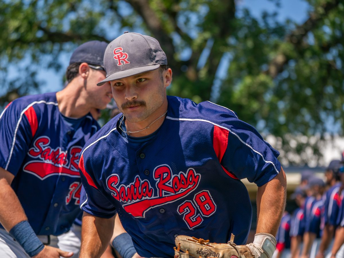 Freshman left fielder Shane Moran bolts toward center field for the national anthem before playing against Sierra in game three of the 3C2A Regional Finals on Sunday, May 18, 2025 in Santa Rosa.