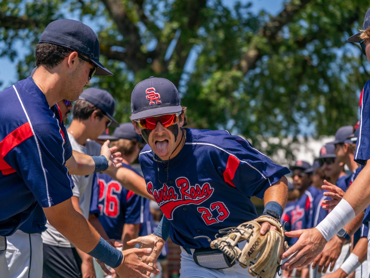 Freshman shortstop hits a pose before running out to center field for the national anthem before playing against Sierra in game three of the 3C2A Regional Finals on Sunday, May 18, 2025 in Santa Rosa.