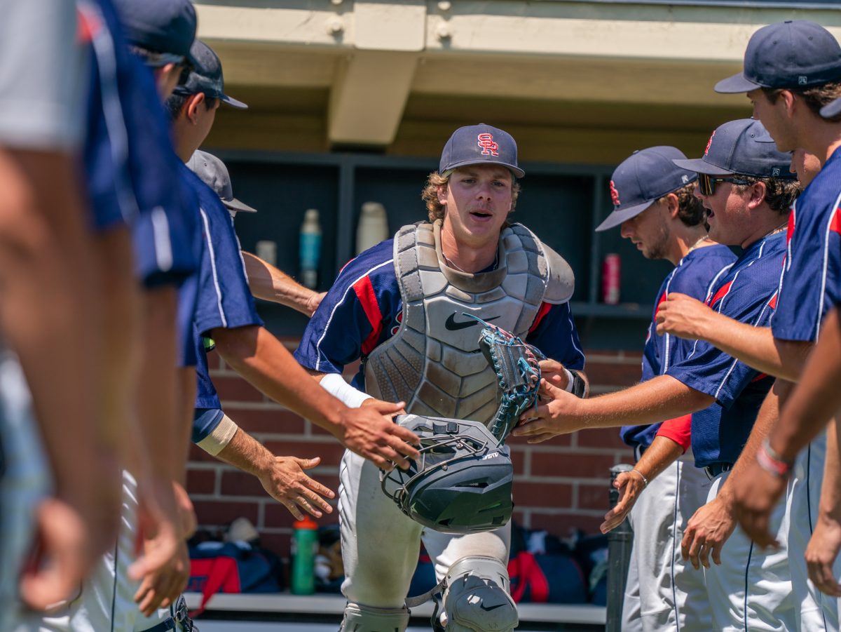 sophomore catcher Mason Cox jogs down the lineup before going to home plate to go against Sierra in game three of the 3C2A Regional Finals on Sunday, May 18, 2025 in Santa Rosa.