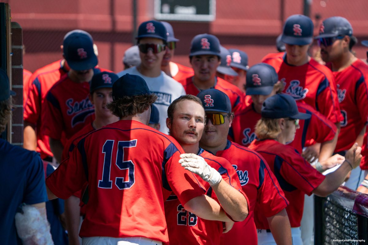 Santa Rosa Junior College's left fielder, Shane Moran embraces teammate, Brett Neidlinger after hitting a home-run which also brought teammate, Joe Brown home during game four of the 3C2A Super Regionals on Saturday, May 10, 2025 in Santa Rosa.